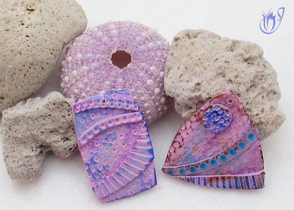 Textured polymer clay beads with pastels